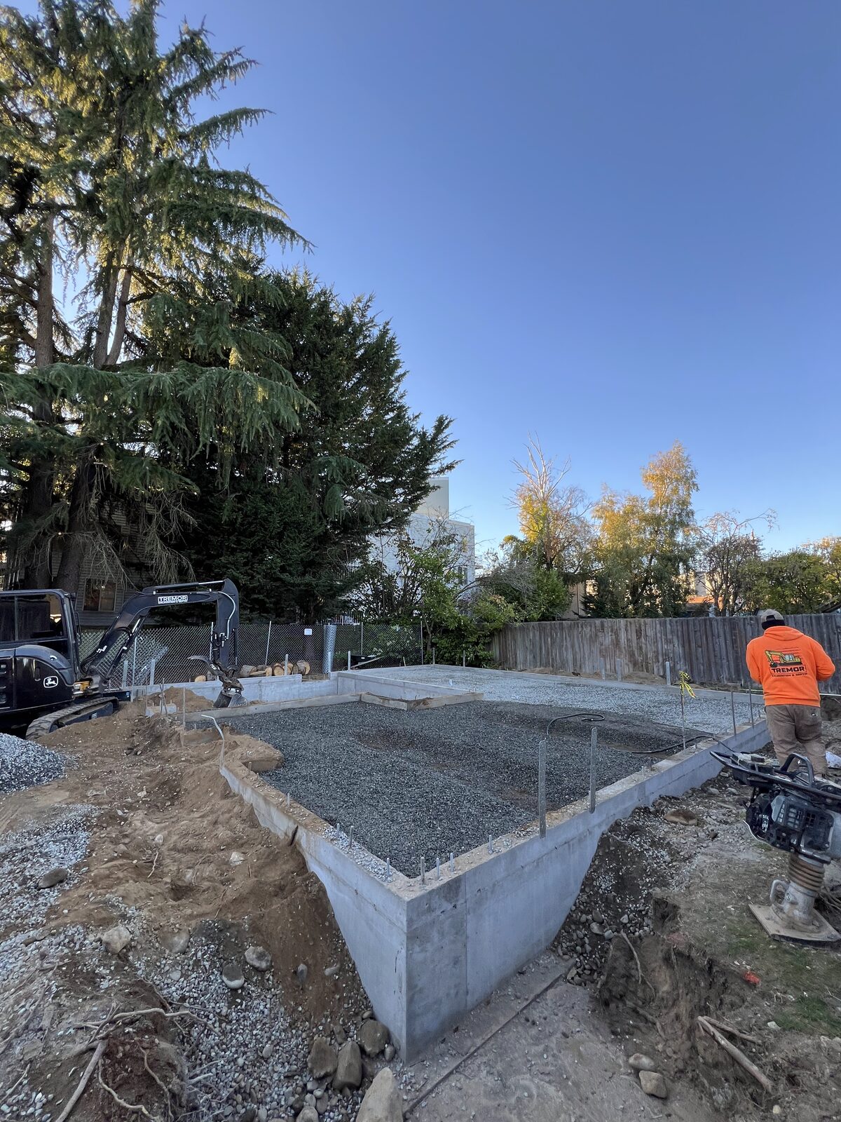 Excavator working a foundation footprint